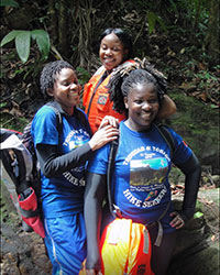 Happy hikers gearing up for a hike in the mountains